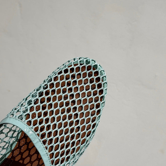 ALAIA FLAT MULES IN LIGHT BLUE MESH FISHNET