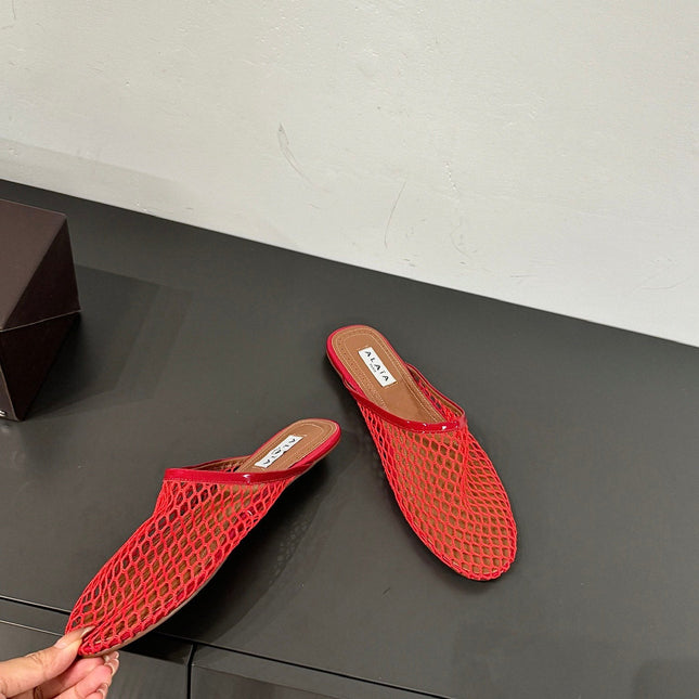 ALAIA FLAT MULES IN CHERRY RED MESH FISHNET