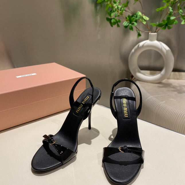 TWO STRAP HIGH HEELED SANDALS IN BLACK GLOSSY SHEEPSKIN