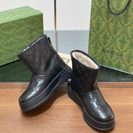 GG UGG BOOTS IN BLACK EMBOSSED SUEDE AND BEIGE WOOL LINING