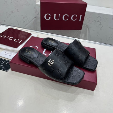 GG CASUAL SLIPPERS IN BLACK CALFSKIN LOGO EMBOSSING