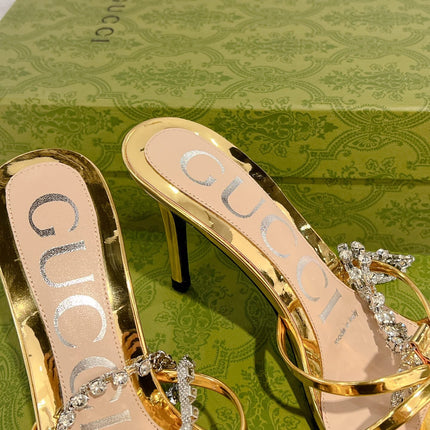 STRAPPY SANDAL WITH RHINESTONE CHAIN IN GOLD PATENT LEATHER