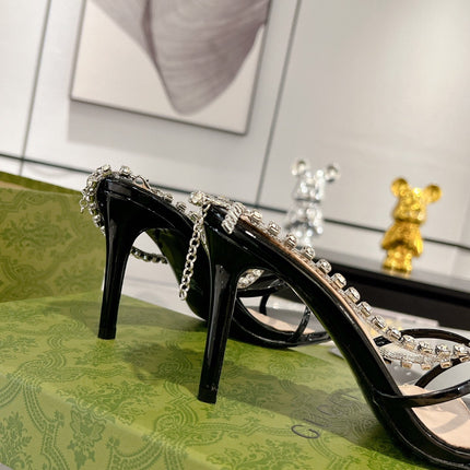 STRAPPY SANDAL WITH RHINESTONE CHAIN IN BLACK PATENT LEATHER