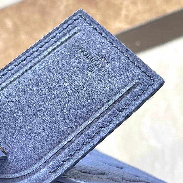 SAC PLAT 24H 41 IN SAPPHIRE BLUE MONOGRAM EMBOSSED TAURILLON