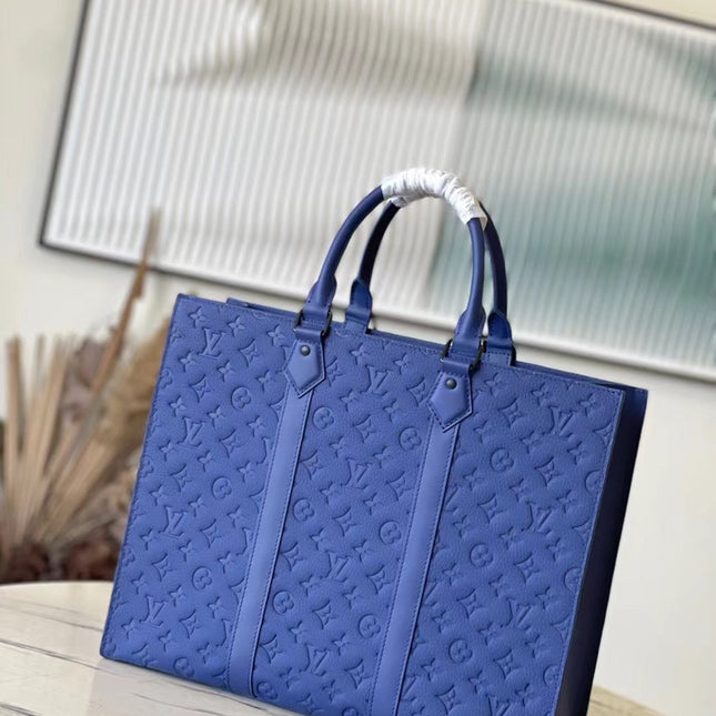 SAC PLAT 24H 41 IN SAPPHIRE BLUE MONOGRAM EMBOSSED TAURILLON