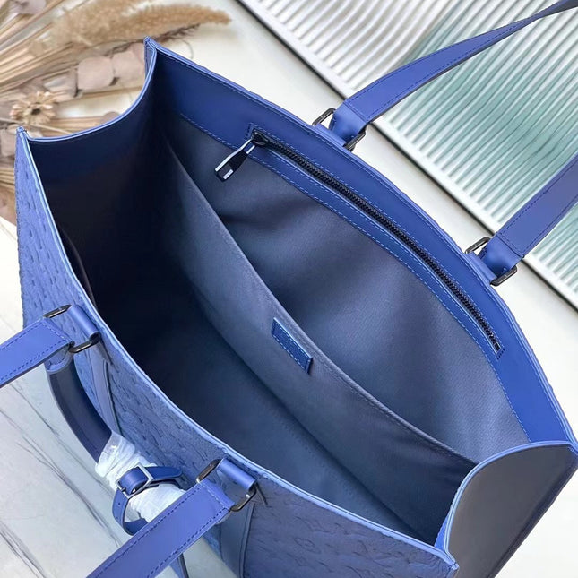 SAC PLAT 24H 41 IN SAPPHIRE BLUE MONOGRAM EMBOSSED TAURILLON
