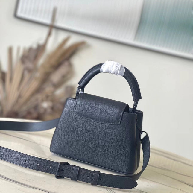 CAPUCINES EAST-WEST MINI 21 IN BLACK TAURILLON
