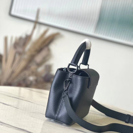 CAPUCINES EAST-WEST MINI 21 IN BLACK TAURILLON