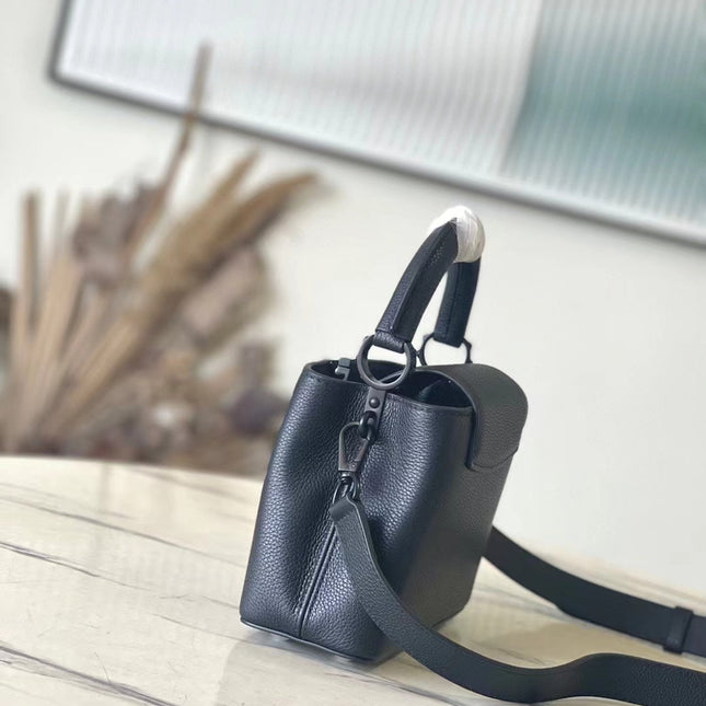 CAPUCINES EAST-WEST MINI 21 IN BLACK TAURILLON