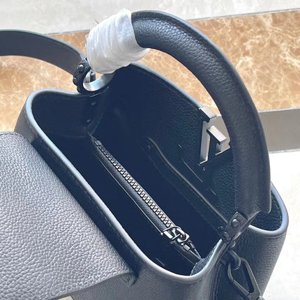 CAPUCINES EAST-WEST MINI 21 IN BLACK TAURILLON
