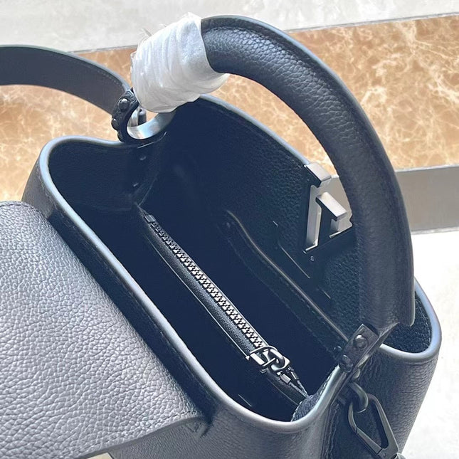 CAPUCINES EAST-WEST MINI 21 IN BLACK TAURILLON