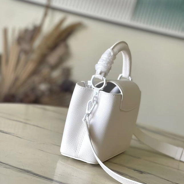 CAPUCINES EAST-WEST MINI 21 IN WHITE TAURILLON