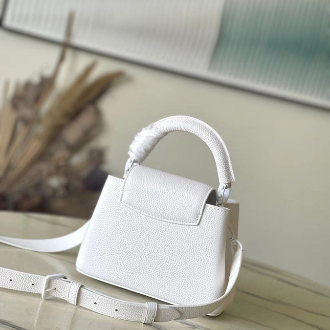 CAPUCINES EAST-WEST MINI 21 IN WHITE TAURILLON