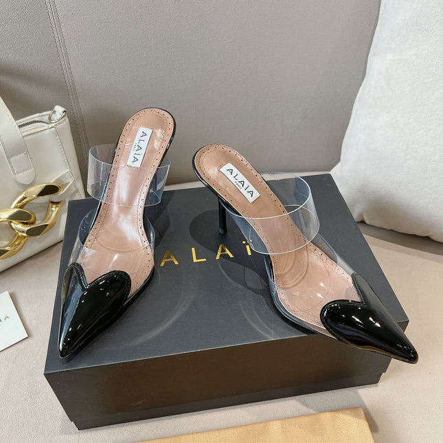 ALAIA HIGH MULES IN BLACK PATENT CALFSKIN AND FILM