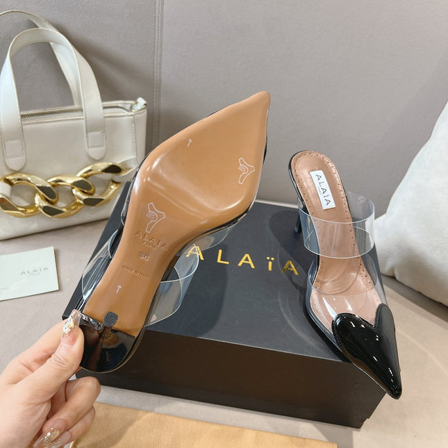 ALAIA HIGH MULES IN BLACK PATENT CALFSKIN AND FILM