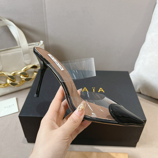 ALAIA HIGH MULES IN BLACK PATENT CALFSKIN AND FILM