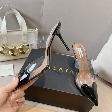 ALAIA HIGH MULES IN BLACK PATENT CALFSKIN AND FILM