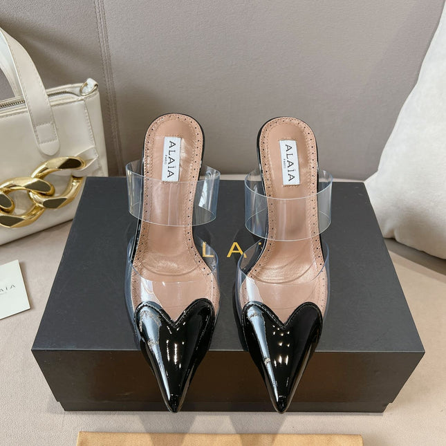 ALAIA HIGH MULES IN BLACK PATENT CALFSKIN AND FILM