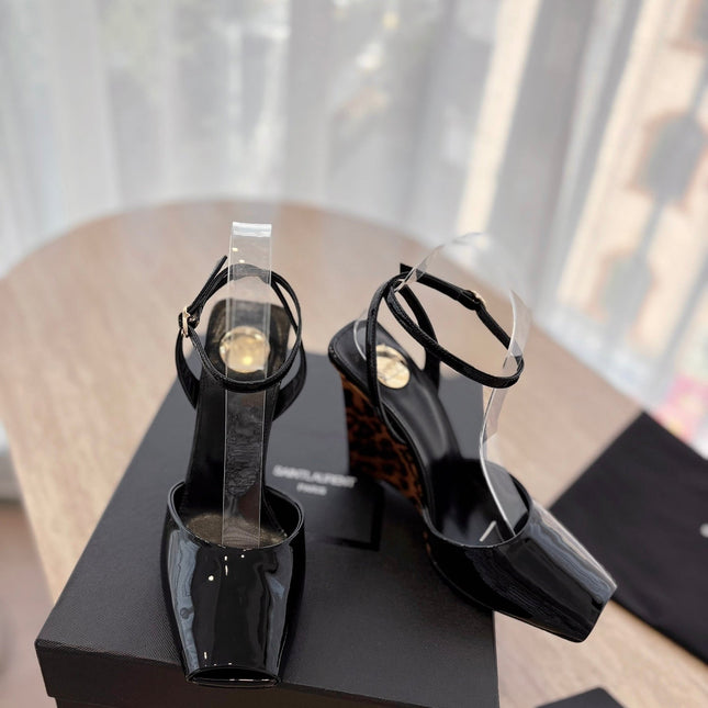 LA SCANDALE HIGH 10 CM WEDGE SANDALS IN BLACK PATENT LEATHER
