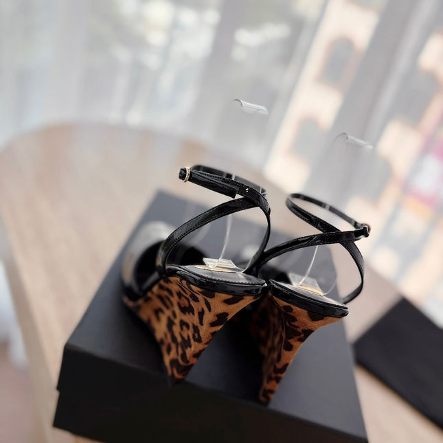 LA SCANDALE HIGH 10 CM WEDGE SANDALS IN BLACK PATENT LEATHER