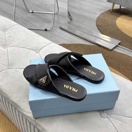PRADA 25S SLIDE SANDALS IN BLACK CALFSKIN LOGO
