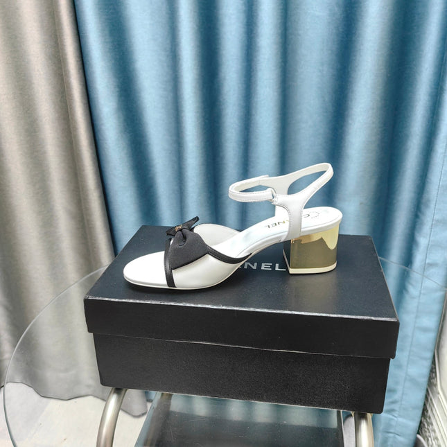 SANDALS IN WHITE SHEEPSKIN WITH BLACK SATIN BOW