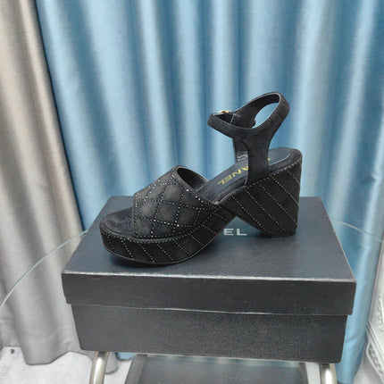 THICK-SOLED WEDGE SANDALS IN BLACK SUEDE