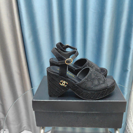 THICK-SOLED WEDGE SANDALS IN BLACK SUEDE