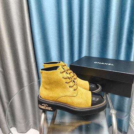 SHORT BOOTS IN GOLD YELLOW SUEDE AND BLACK SHEEPSKIN