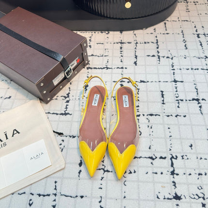 ALAIA FLAT SLINGBACK IN YELLOW PATENT CALFSKIN AND FILM