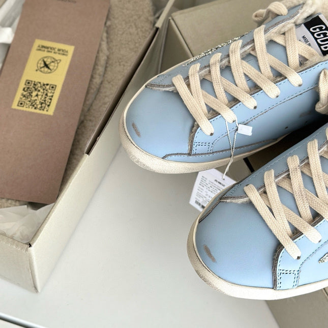 SUPER-STAR SABOTS IN BLUE CALFSKIN WITH GLITTER WHITE STAR