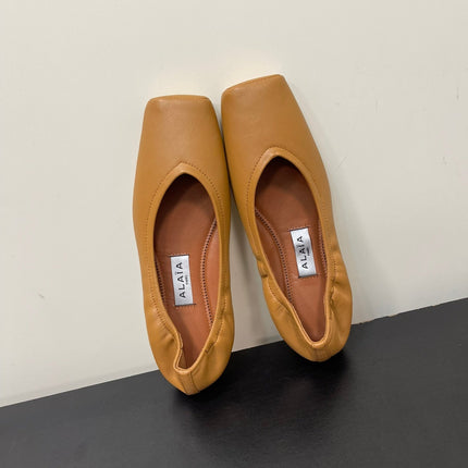 ALAIA BALLET FLATS IN COPPER BROWN SMOOTH CALFSKIN