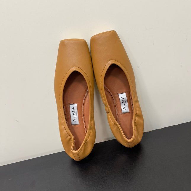 ALAIA BALLET FLATS IN COPPER BROWN SMOOTH CALFSKIN