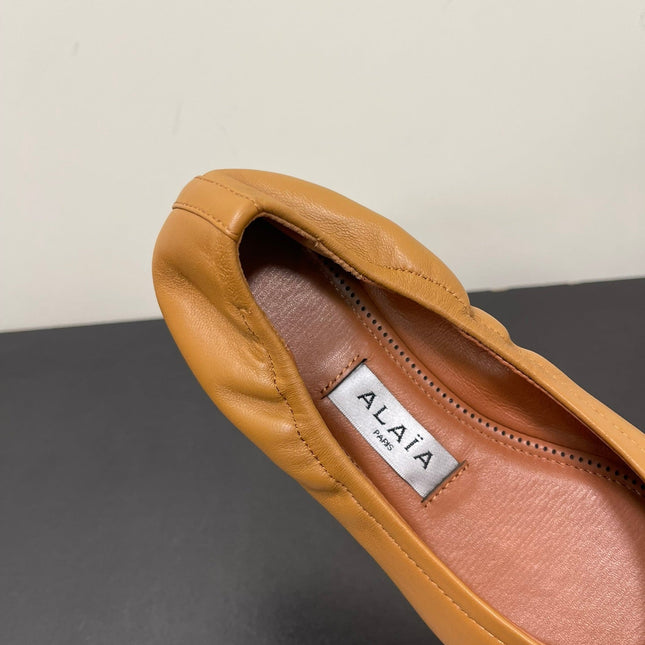 ALAIA BALLET FLATS IN COPPER BROWN SMOOTH CALFSKIN
