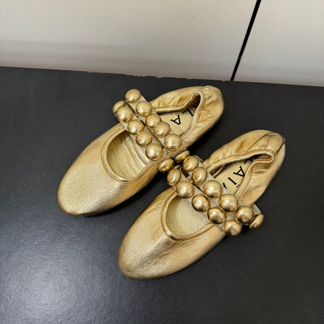 ALAIA SPHERE BALLET FLATS IN GOLDEN LAMBSKIN