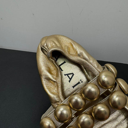 ALAIA SPHERE BALLET FLATS IN GOLDEN LAMBSKIN