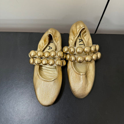 ALAIA SPHERE BALLET FLATS IN GOLDEN LAMBSKIN
