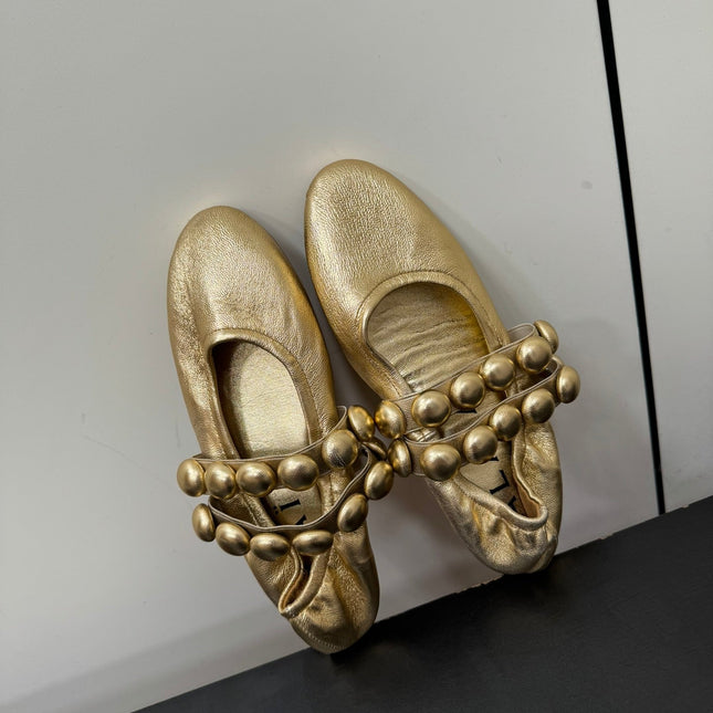 ALAIA SPHERE BALLET FLATS IN GOLDEN LAMBSKIN