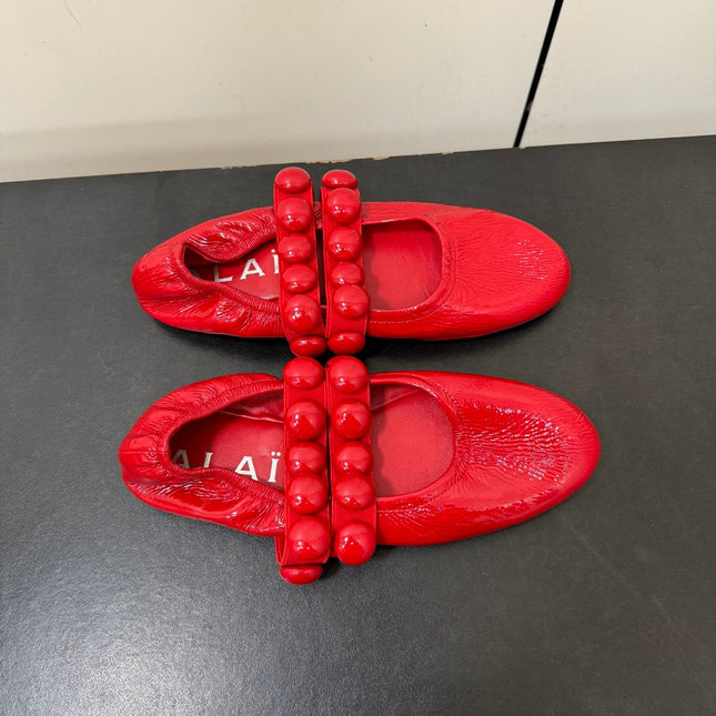 ALAIA SPHERE BALLET FLATS IN CHERRY RED LAMBSKIN