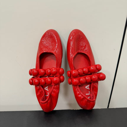 ALAIA SPHERE BALLET FLATS IN CHERRY RED LAMBSKIN
