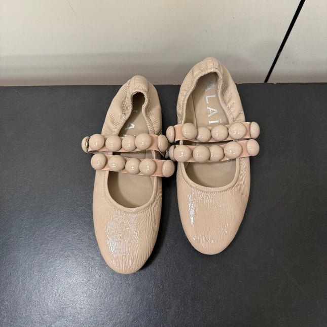ALAIA SPHERE BALLET FLATS IN ALMOND BEIGE LAMBSKIN