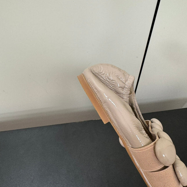 ALAIA SPHERE BALLET FLATS IN ALMOND BEIGE LAMBSKIN