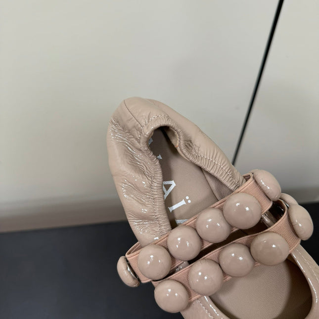 ALAIA SPHERE BALLET FLATS IN ALMOND BEIGE LAMBSKIN