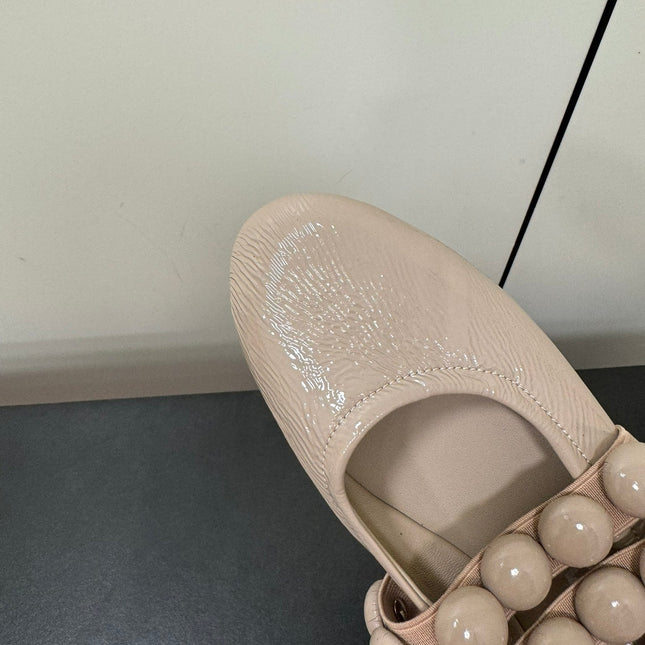 ALAIA SPHERE BALLET FLATS IN ALMOND BEIGE LAMBSKIN