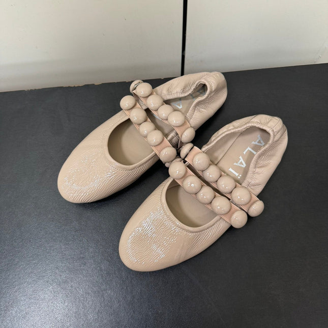 ALAIA SPHERE BALLET FLATS IN ALMOND BEIGE LAMBSKIN