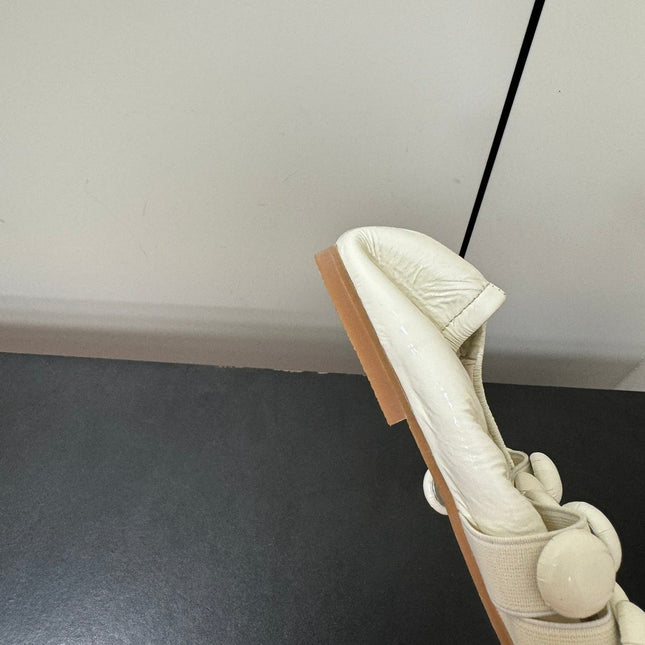ALAIA SPHERE BALLET FLATS IN WHITE LAMBSKIN