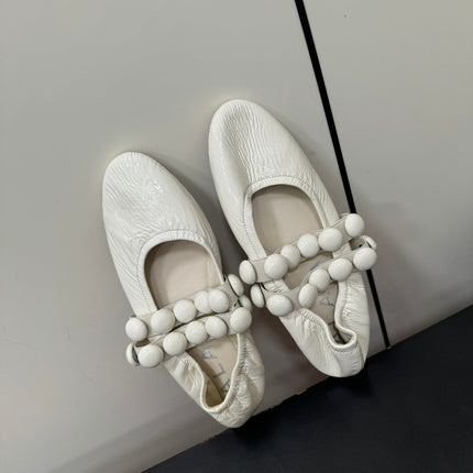 ALAIA SPHERE BALLET FLATS IN WHITE LAMBSKIN