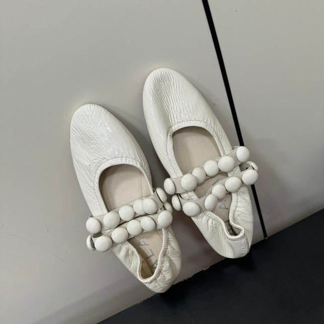 ALAIA SPHERE BALLET FLATS IN WHITE LAMBSKIN