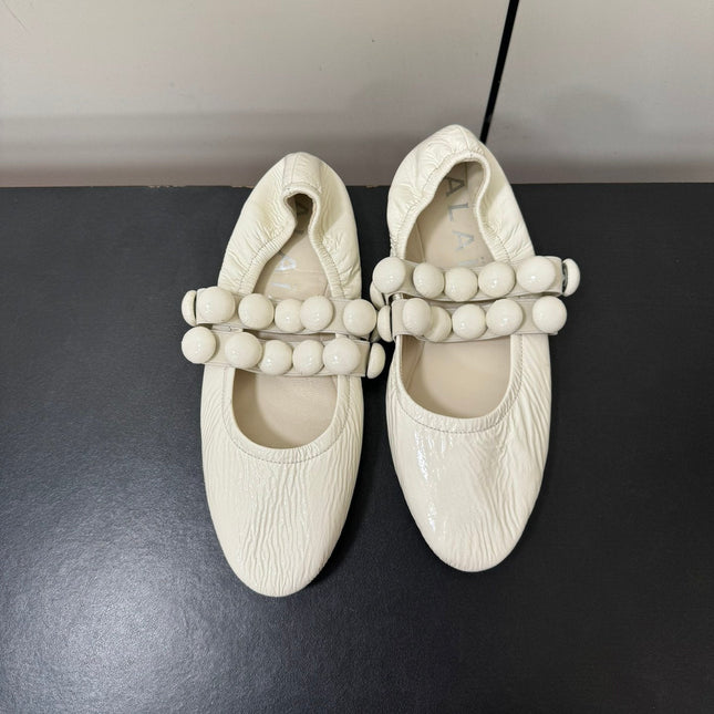 ALAIA SPHERE BALLET FLATS IN WHITE LAMBSKIN