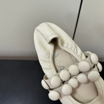 ALAIA SPHERE BALLET FLATS IN WHITE LAMBSKIN
